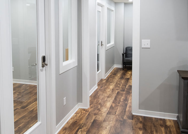 hallway with brown floors and grey walls at the workstation